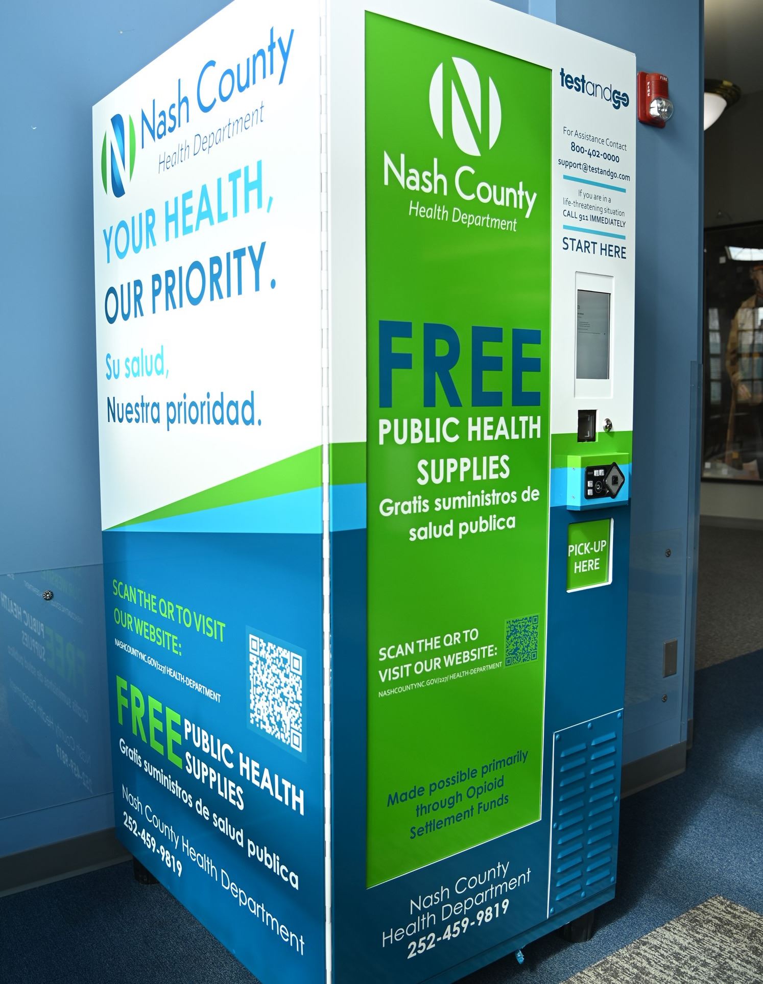Photo of the public health kiosk against the wall in the library.